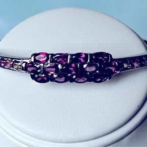 Rhodolite garnet and sterling silver bangle.
